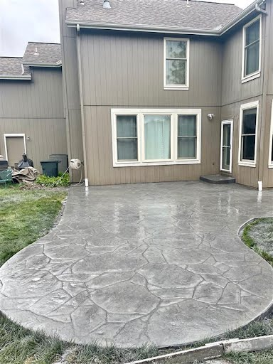 Stamped concrete patio with decorative cobblestone pattern