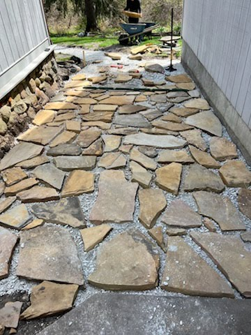 Newly laid flagstone walkway alongside a home